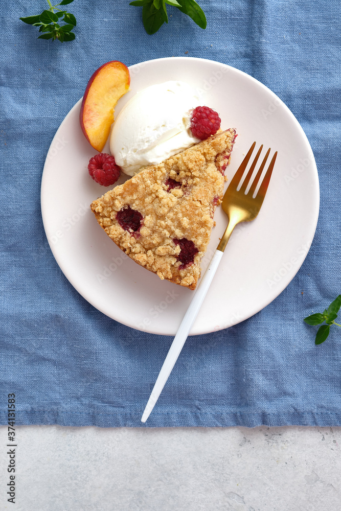 Raspberry and crumble pie. Fresh dessert fruit tart covered in raspberries. Raspberry and crumble pie. Fresh dessert fruit tart covered in raspberries.