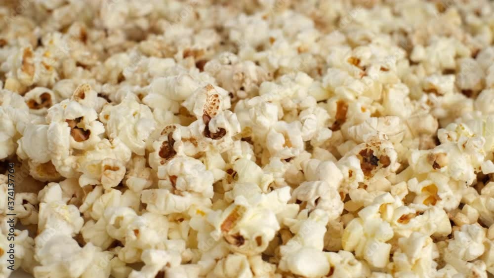 popcorn closeup rotating. Popcorn background. Cinema pop corn background