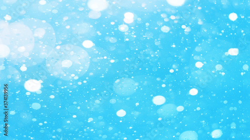 snowflakes isolated on blue sky - winter snow background