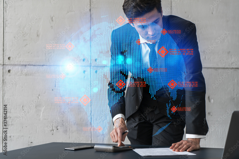 Businessman in office signs contract and world map hologram. Double exposure. Formal wear. International business connection. Businessman in office signs contract and world map hologram. Double exposure. Formal wear. International business connection.