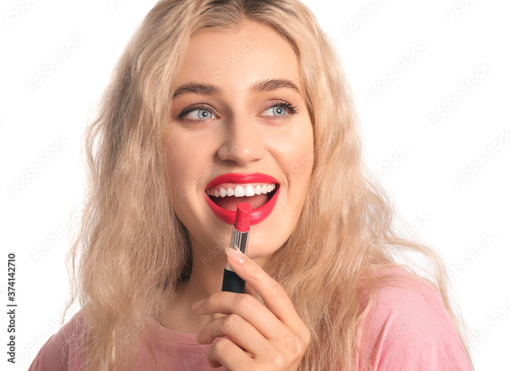 Beautiful young woman with lipstick on white background Beautiful young woman with lipstick on white background