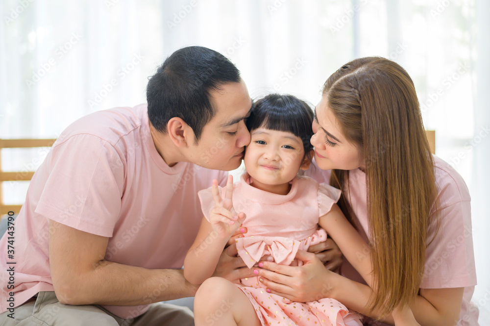 portrait of happy Asian family in white bedroom portrait of happy Asian family in white bedroom