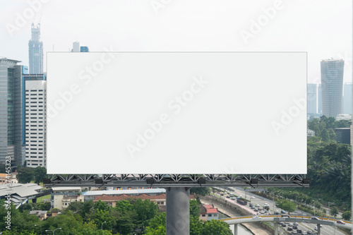 Photography Blank white road billboard with KL cityscape background at day time