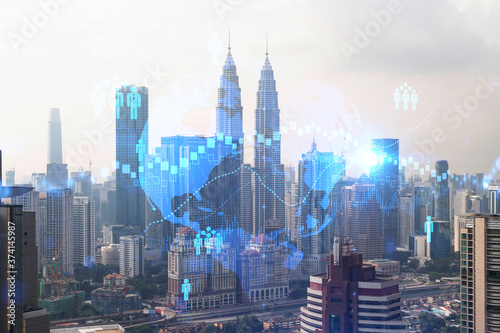 Social media icons hologram over panorama city view of Kuala Lumpur  Malaysia  Asia. The concept of people networking and connections. Double exposure.