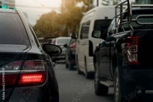 Rear light of car on asphalt road. Traffic jams in the evening with other cars. © thongchainak
