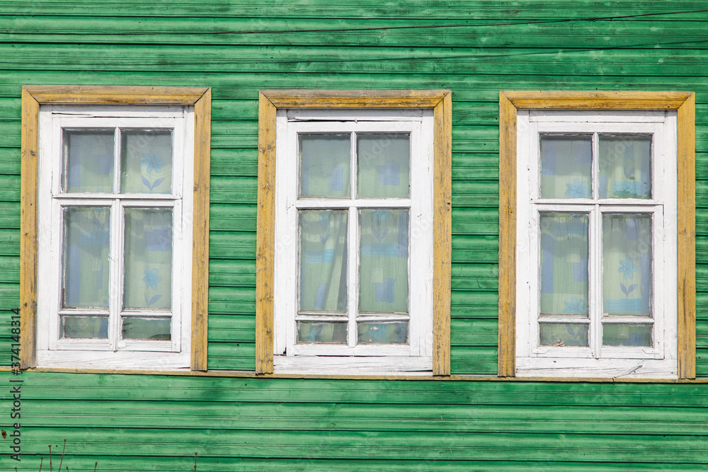 Traditional Russian carved wooden windows in an old house