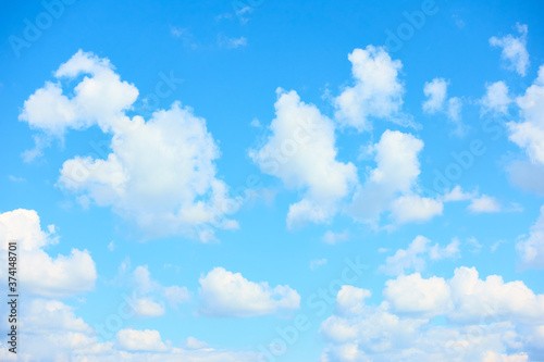 Light blue sky with beautiful white clouds