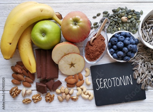 Serotonin-boosting foods. Assortment of food for good mood, happiness, better memory, and positive mind. Healthful foods rich in serotonin. Natural sources of serotonin, healthy diet. photo