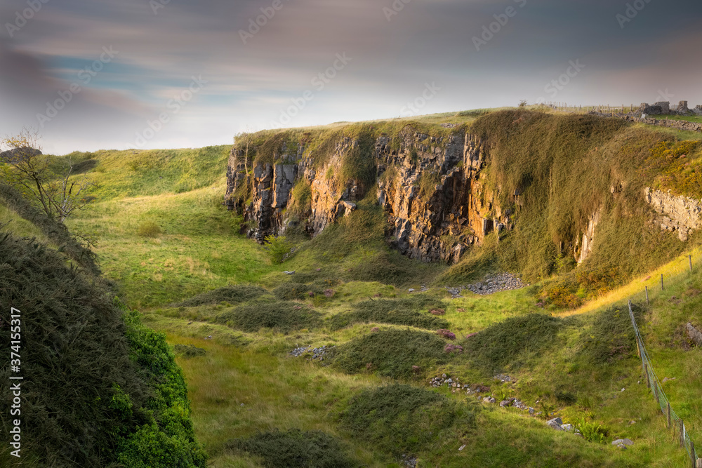 Dusk over a derelict limestone quarry on the wild headland of Penwyllt in South Wales, UK

