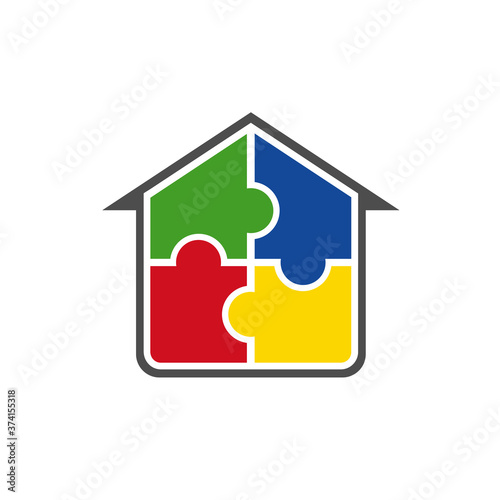 A house made up of puzzle pieces. 