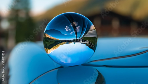 Crystal ball alpine landscape shot on a car roof with reflections at the famous Hintertuxer Gletscher, Tyrol, Austria