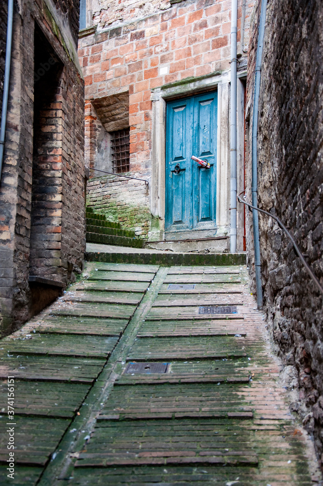 Old Italian front door in Urbino town, Italy