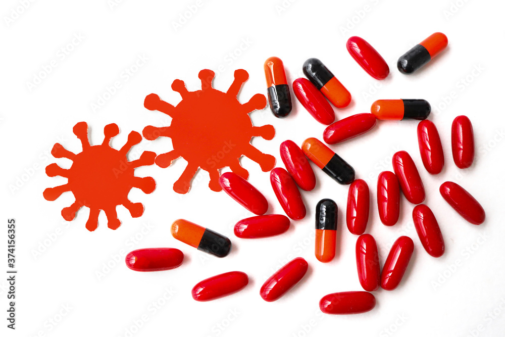 Medicine capsules, virus red on a white background. Protection from disease. Medicine capsules, virus red on a white background. Protection from disease.