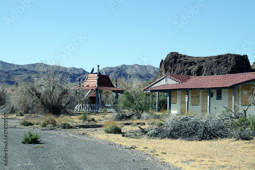 it looks ghost town that abandoned old house under volcano mountain in desert © James