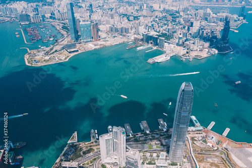 Aerial scenery panoramic view from drone of Hong Kong skyscrapers skyline with metropolitan bay. Modern concrete cityscape of urban downtown with business and financial buildings. City infrastructure