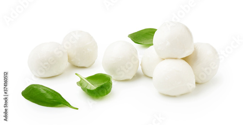 Mini Mozaarella cheese balls with fresh basil leaves isolated on white background. Heap of Mozzarella cheese. photo