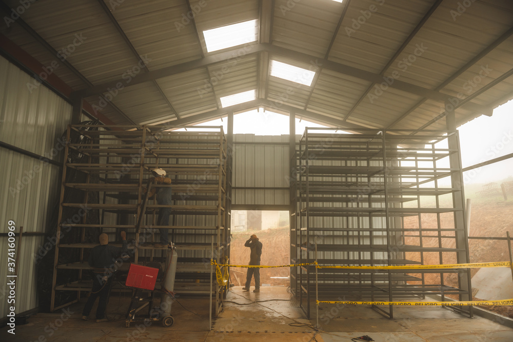 Naklejka premium El Oro / Ecuador - 2017 : A construction site, building of a huge barn 