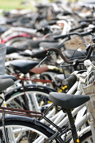 Many bicycles at parking space 