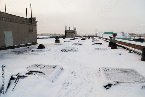 Rooftop of industrial building covered with snow in Saint Petersburg