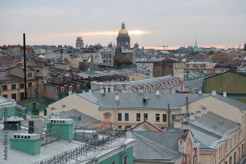 Saint Petersburg rooftop cityscape in time of sunset with view on Saint Isaac's cathedral
