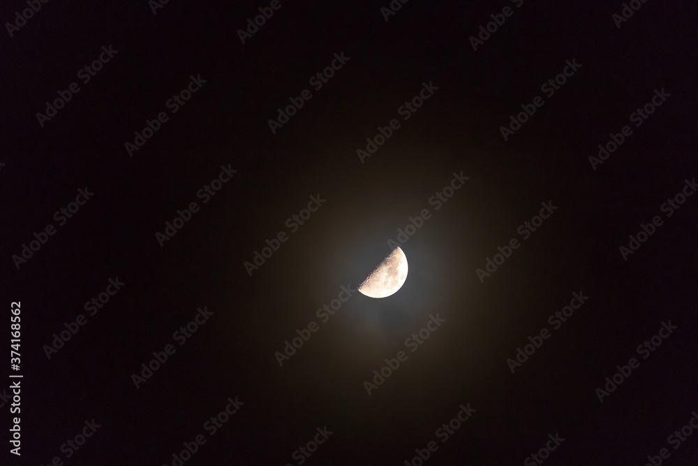 Beautiful moon on dark sky. Half Moon refers to the two lunar phases commonly known as first quarter and last quarter. Beautiful moon on dark sky. Half Moon refers to the two lunar phases commonly known as first quarter and last quarter.