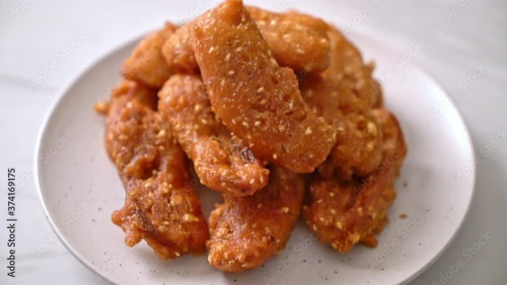 deep fried sliced potatoes stick with sesame - Thai food style deep fried sliced potatoes stick with sesame - Thai food style