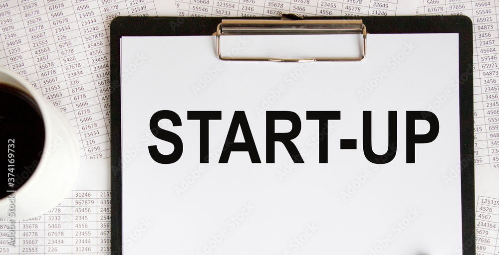 paper notebook with inscription start up , business concept paper notebook with inscription start up , business concept