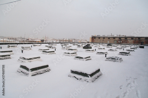 Rooftop of industrial building covered with snow in Saint Petersburg