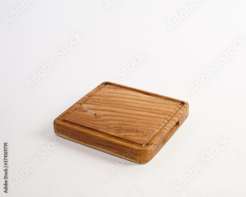 trays made of used wood, commonly used to serve food and drinks in restaurants. a tray made from recycled and polished wood waste so that it becomes an elegant and unique wooden tray. © AndhikaRaya