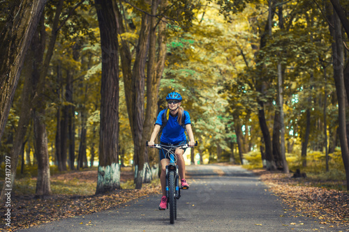 Wallpaper Mural woman cyclist rides mountain bike forest trails. Torontodigital.ca