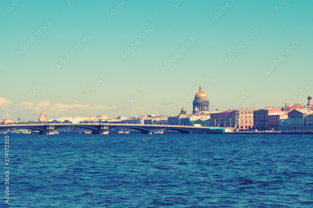 Sightseeing view of Neva river embankment and old architecture in Saint Petersburg, Russia