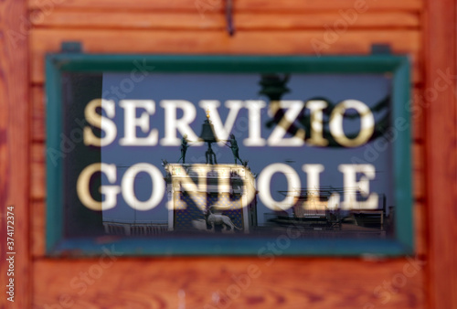 Italian text that means gondola service with the reflection in V