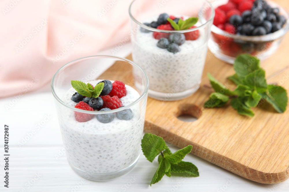 chia pudding with natural yogurt and fresh berries close-up on the table.
chia pudding with natural yogurt and fresh berries close-up on the table.