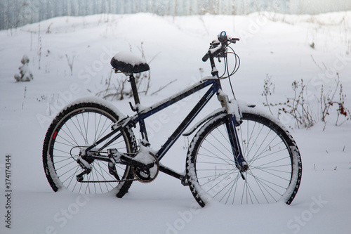 Bike covered with fresh snow © Chepko Danil