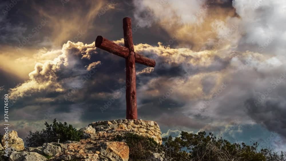 a cross pole with a storm cloud background accompanied by flashes of lightning