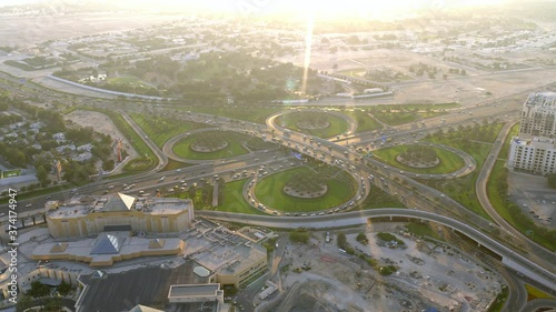 An aerial view flying over WAFI Mall and Hotel Raffles staring at the busy interchange panning right to a view of the vast neighborhood, 6-axis stabilized gimbal, Shotover F1, 8K, parallax. photo