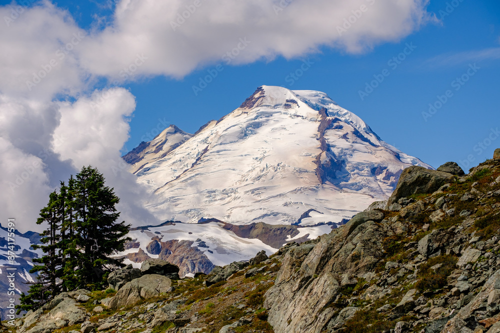 A snow-capped Mt. Baker looms over the Herman saddle pass hiking trail