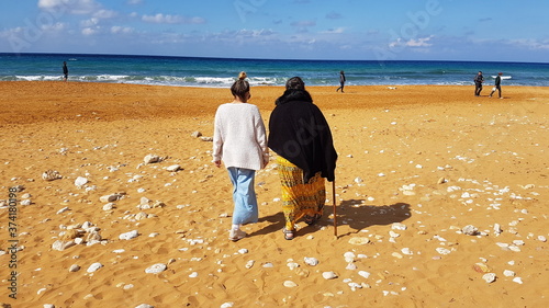 lady and grandma on the beach