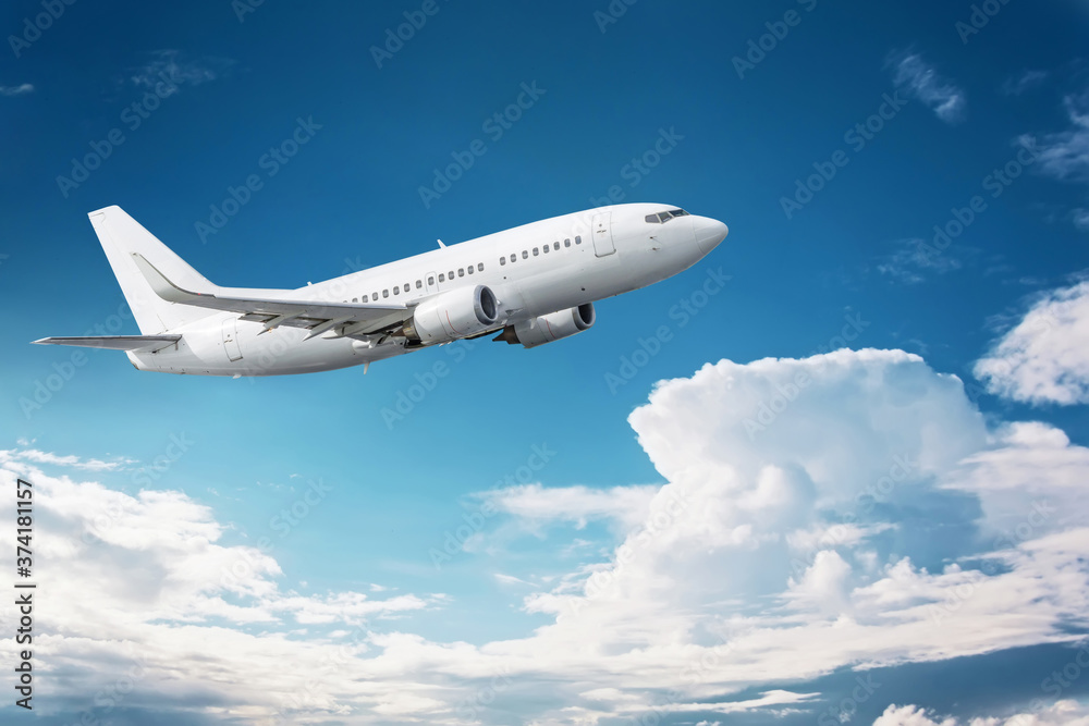Civil aircraft flying into deep blue skies with some clouds Civil aircraft flying into deep blue skies with some clouds
