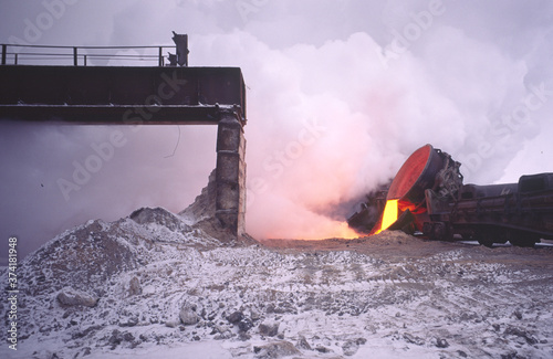 Clouds of steam when cooling a hot metallurgical blast furnace slag to obtain granules necessary for the production of slag cement.