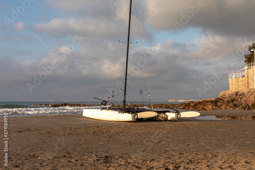 Photos A catamaran or Hobie cat boat stands in a Spanish beach