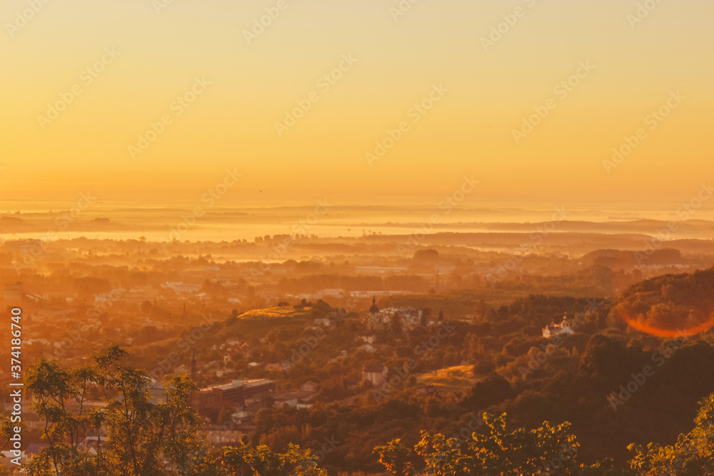 Dawn over the city. Panorama of the city in the rays of the sun.
sunset in the mountains