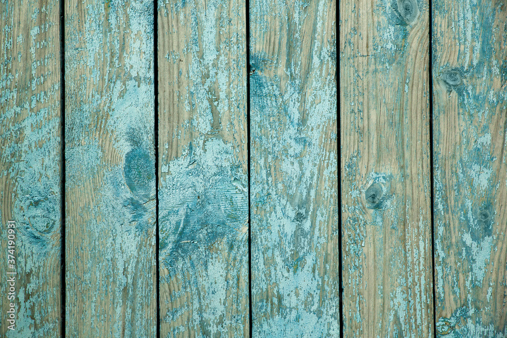 Texture of old boards with blue peeling paint. Background Texture of old boards with blue peeling paint. Background