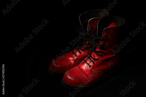 Red punk boots with black background