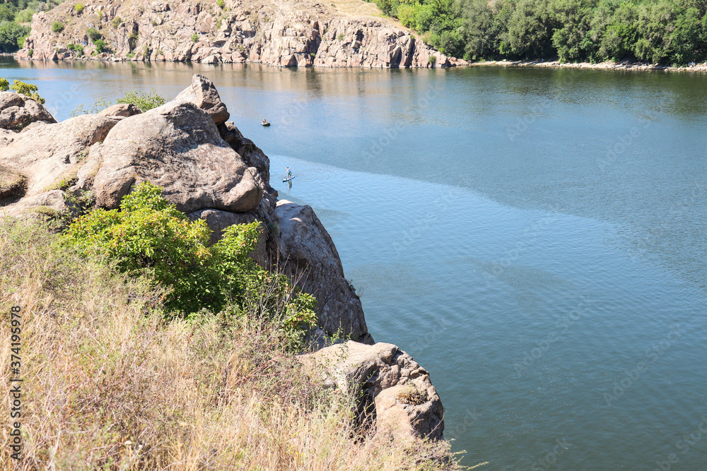 rocky coast of the river. panoramic view of a large and wide river rocky coast of the river. panoramic view of a large and wide river