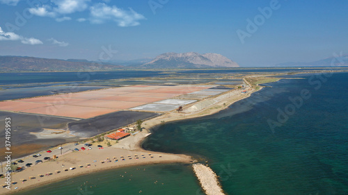 Aerial drone photo of artificial sea salt ponds in area Tourlida of Kleisova lagoon featuring seaside traditional settlement, Mesolongi, Aitoloakarnania, Greece photo