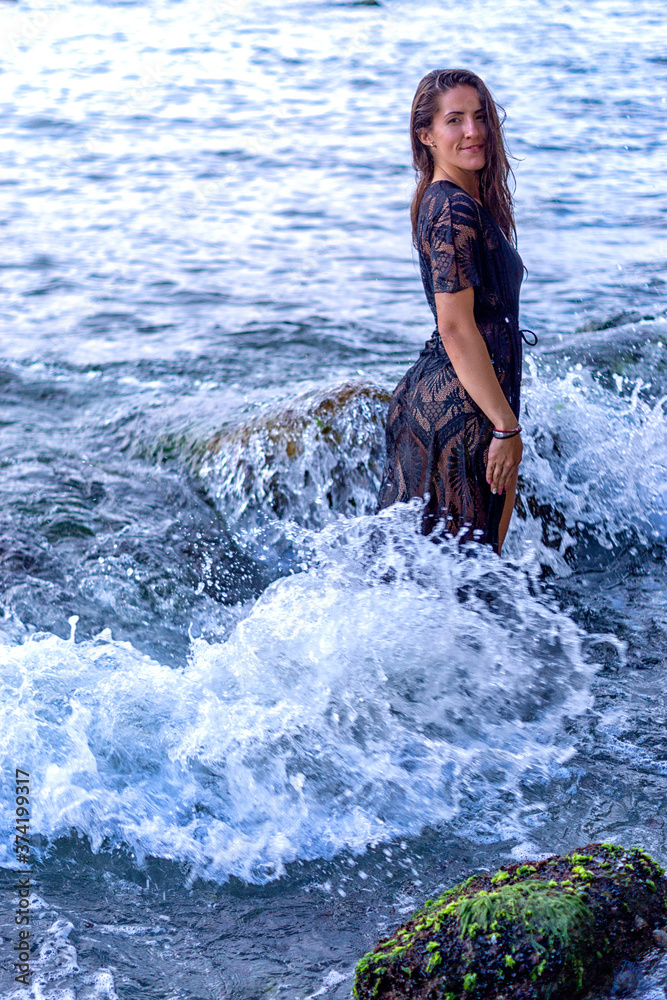 Fototapeta premium young woman in the sea
