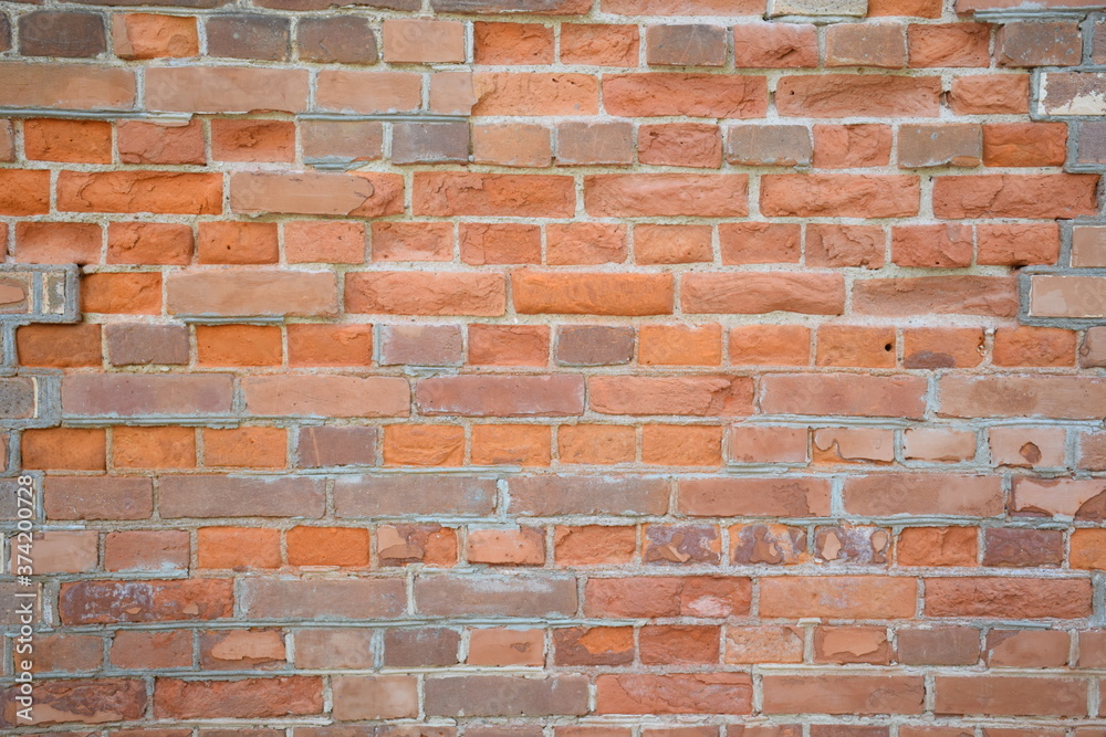 bright background: old brick wall, rough texture with beige, red, gray, brown bricks bright background: old brick wall, rough texture with beige, red, gray, brown bricks