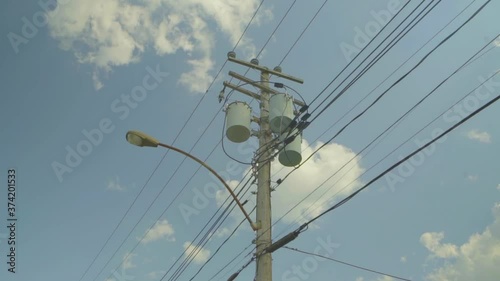 Montreal, Canada - June 5, 2018: Wire electric in pole, Electricity post and wires on the background of clear sky. Wire electricity post