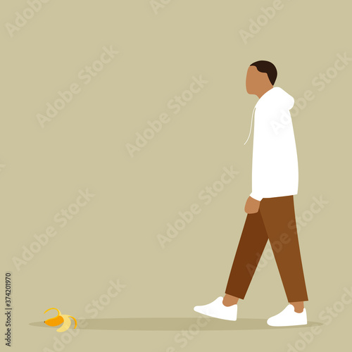 
A male character goes, and on the floor in front of him is a banana peel